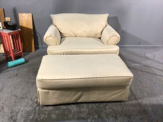 Sand colored oversized chair and ottoman