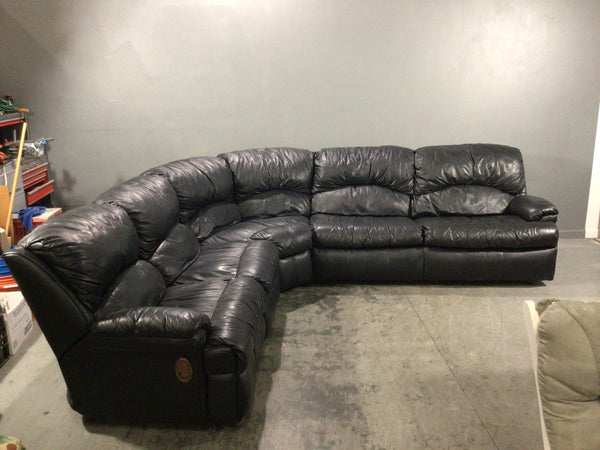 Black leather sectional with pull out bed