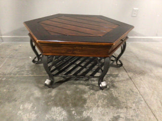 Dark brown coffee table with wrought iron base